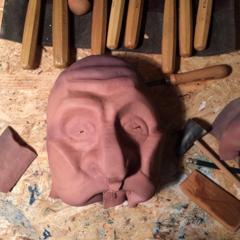leather mask in the process for a commedia dell arte mask of brighella