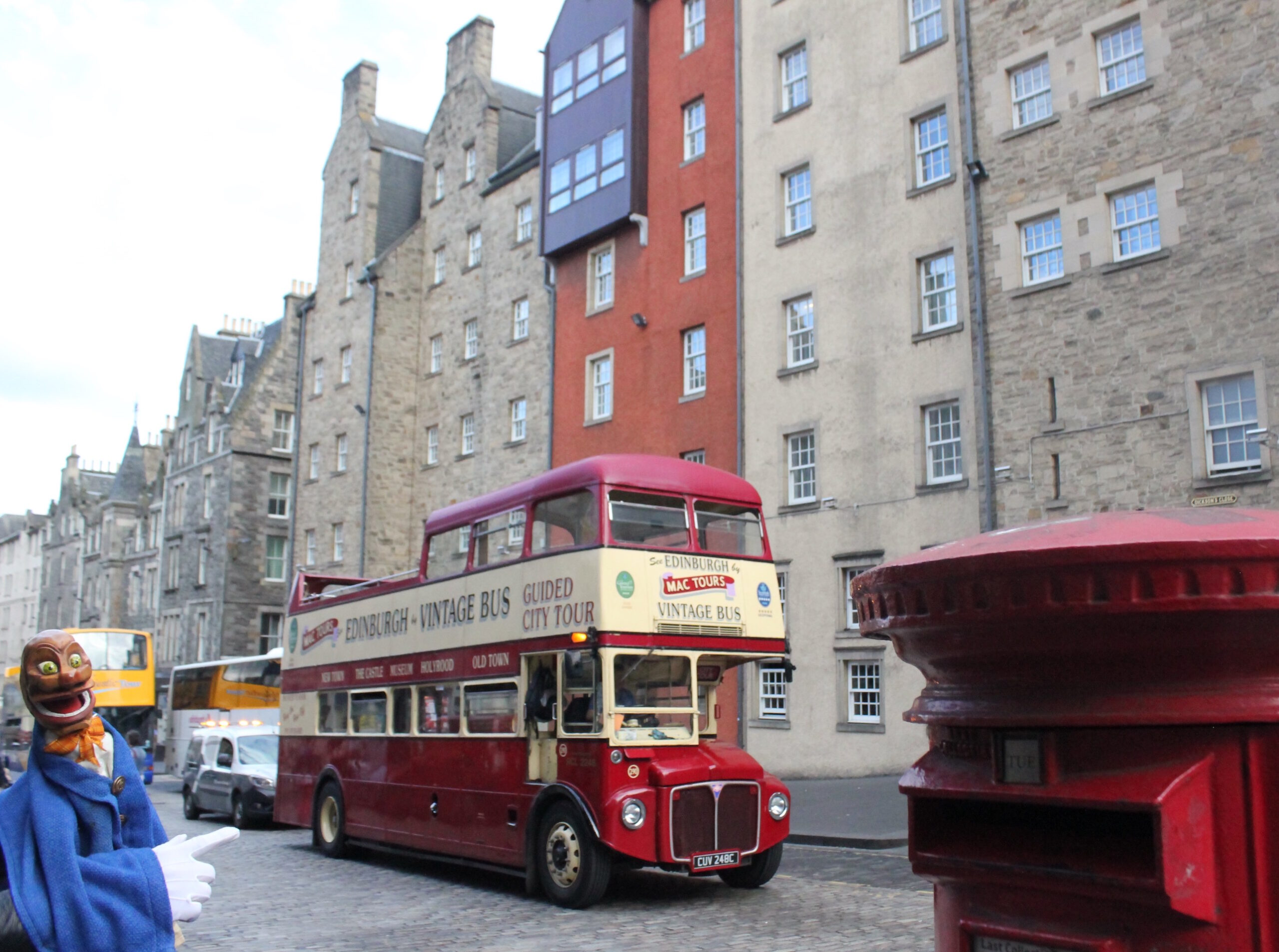 Igor next to a double-decker bus in Edinburgh