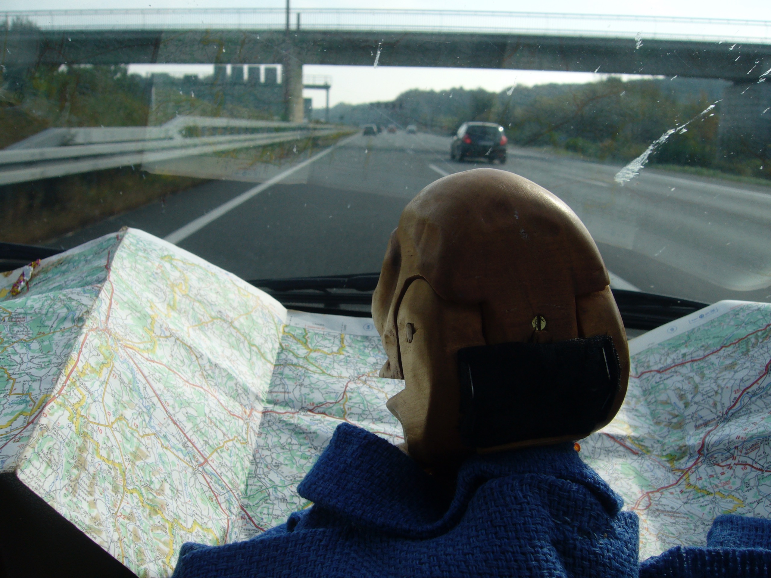 Igor in a car holding a road map